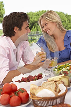 Young Couple Enjoying Outdoor Meal Together