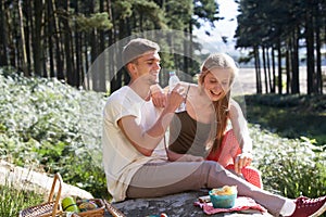 Young Couple Enjoying Picnic In Countryside