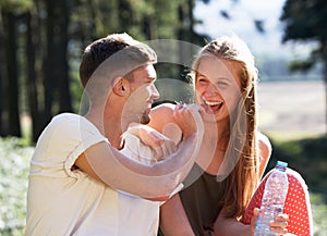 Young Couple Enjoying Picnic In Countryside