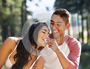 Young Couple Enjoying Picnic In Countryside