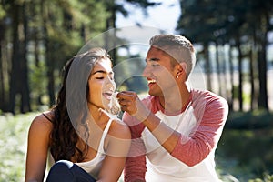 Young Couple Enjoying Picnic In Countryside