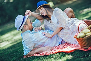 Young couple enjoying picnic time outdoor