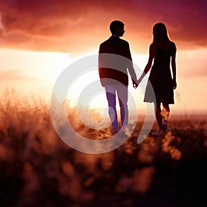 Young couple enjoying the sunset