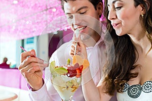 Young couple enjoying their time in ice cream parlor