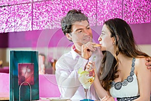 Young couple enjoying their time in ice cream parlor