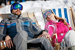 Young couple enjoying together in sun at mountains