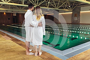 Young couple enjoying treatments and relaxing at wellness spa center