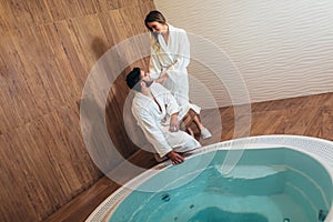 Young couple enjoying treatments and relaxing at wellness spa center