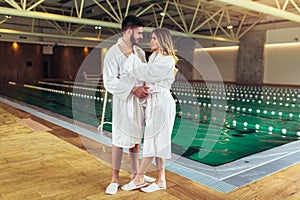 Young couple enjoying treatments and relaxing at wellness spa center