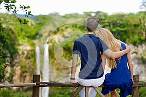 Young couple enjoying a view on Chamarel falls