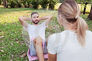 Young couple excercise in the park