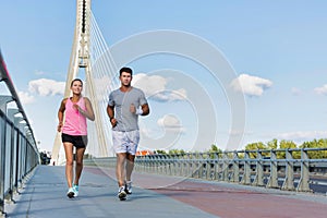 Young couple excersising in the middle of the city