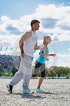 Young couple excersising in park