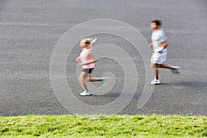 Young couple excersising in park