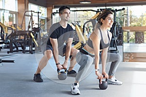 Young couple exercise together in gym healthy lifestyle