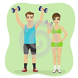 Young couple exercising with dumbbells together