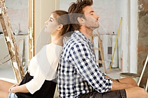 Young couple exhausted in DIY