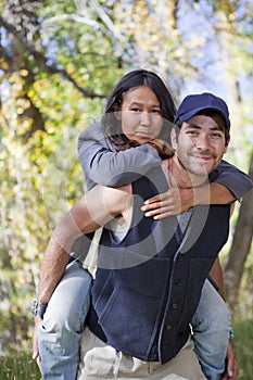 Young couple in fall forest