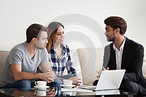 Young couple, family at meeting with realtor, interior designer