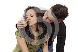 Young couple feeding each other chocolate