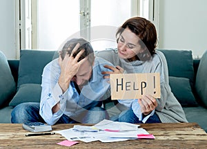 Young Couple Feeling sad and stressed paying bills debts mortgage having financial problems