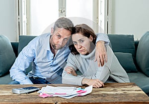 Young Couple Feeling sad and stressed paying bills debts mortgage having financial problems