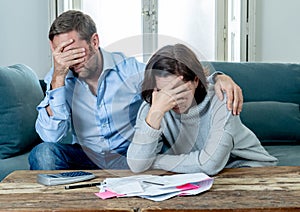 Young Couple Feeling sad and stressed paying bills debts mortgage having financial problems