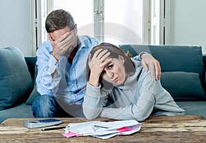 Young Couple Feeling sad and stressed paying bills debts mortgage having financial problems