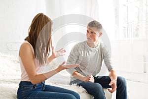 Young couple find out the relationship of cursing in the bedroom. Indoors bedroom.
