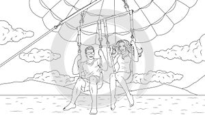 A young couple flies on a parachute