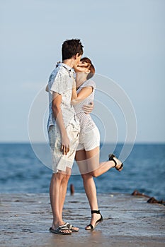 Young couple flirting on pier