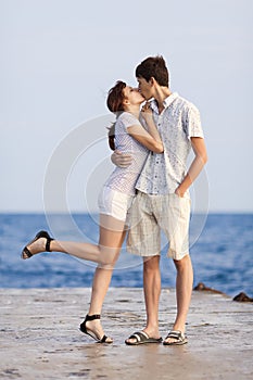 Young couple flirting on pier