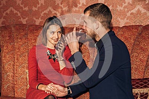 Young couple flirting at restaurant and drinking wine