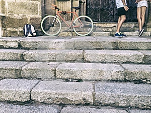 Young couple friendship with a fixed gear bicycle
