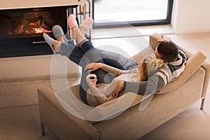 Young couple in front of fireplace