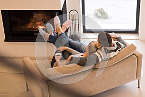 Young couple in front of fireplace