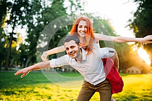 Young couple funs together in summer park