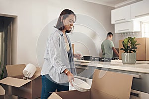 Young couple, furniture and moving to home with boxes for renovation, investment or relocation. Partners, man and woman