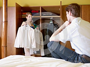 Young couple getting dressed