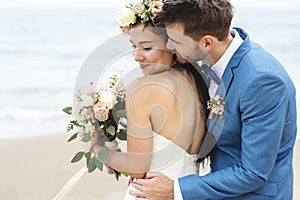 Young couple getting married at the beach