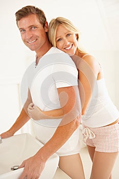 Young Couple Getting Ready In Bathroom