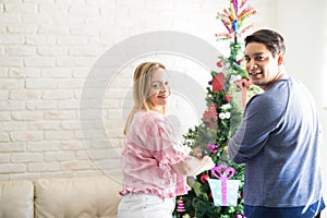 Young couple getting ready for Christmas