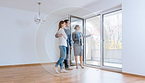 Young couple getting tour through apartment they consider renting