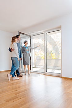 Young couple getting tour through apartment they consider renting