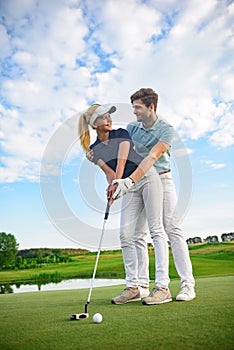 Young couple on golf course