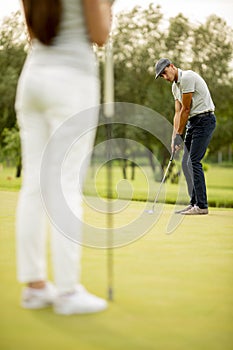 Young couple at golf court