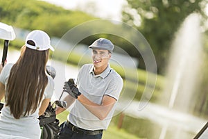 Young couple at golf court