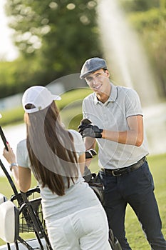 Young couple at golf court