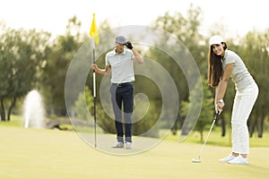 Young couple at golf court