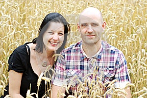 Young couple in a grain field